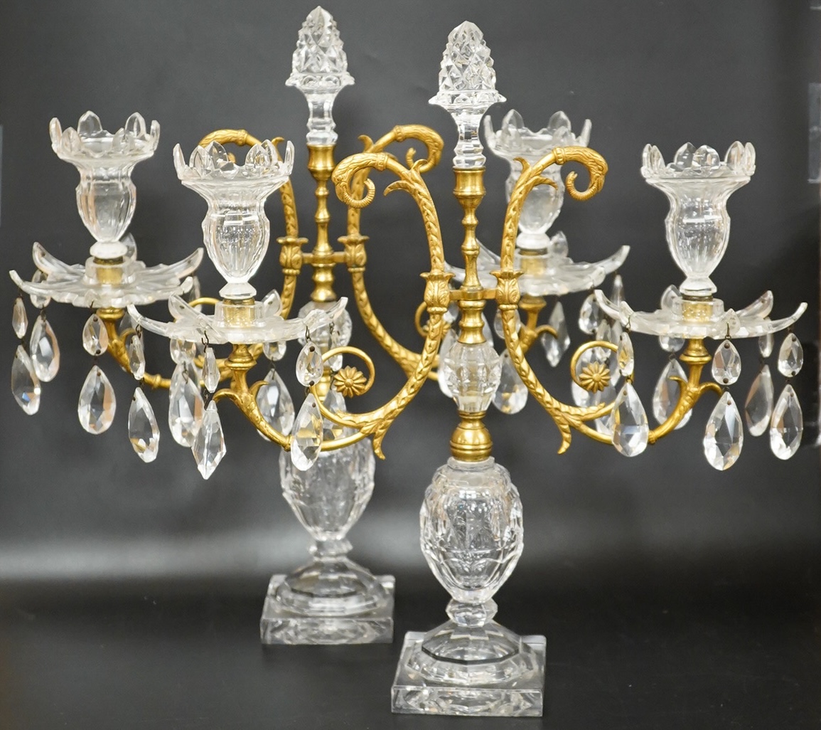 A pair of 19th century glass and gilt metal two branch candelabra with drops, 40cm high